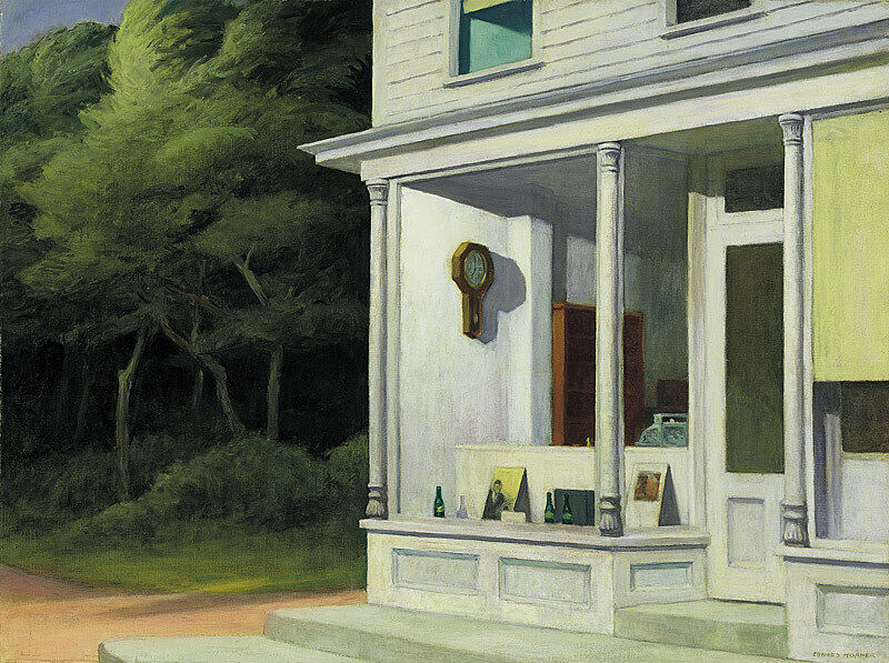 Gallery storefront with trees in background.